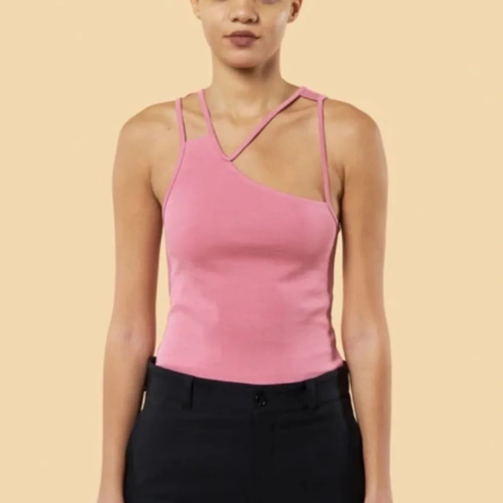 Kingley unisex gender inclusive fist asymmetric strappy tank pink 13696